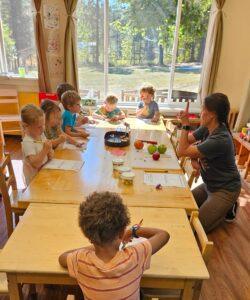 Preschool students learning about the life cycle of an apple.